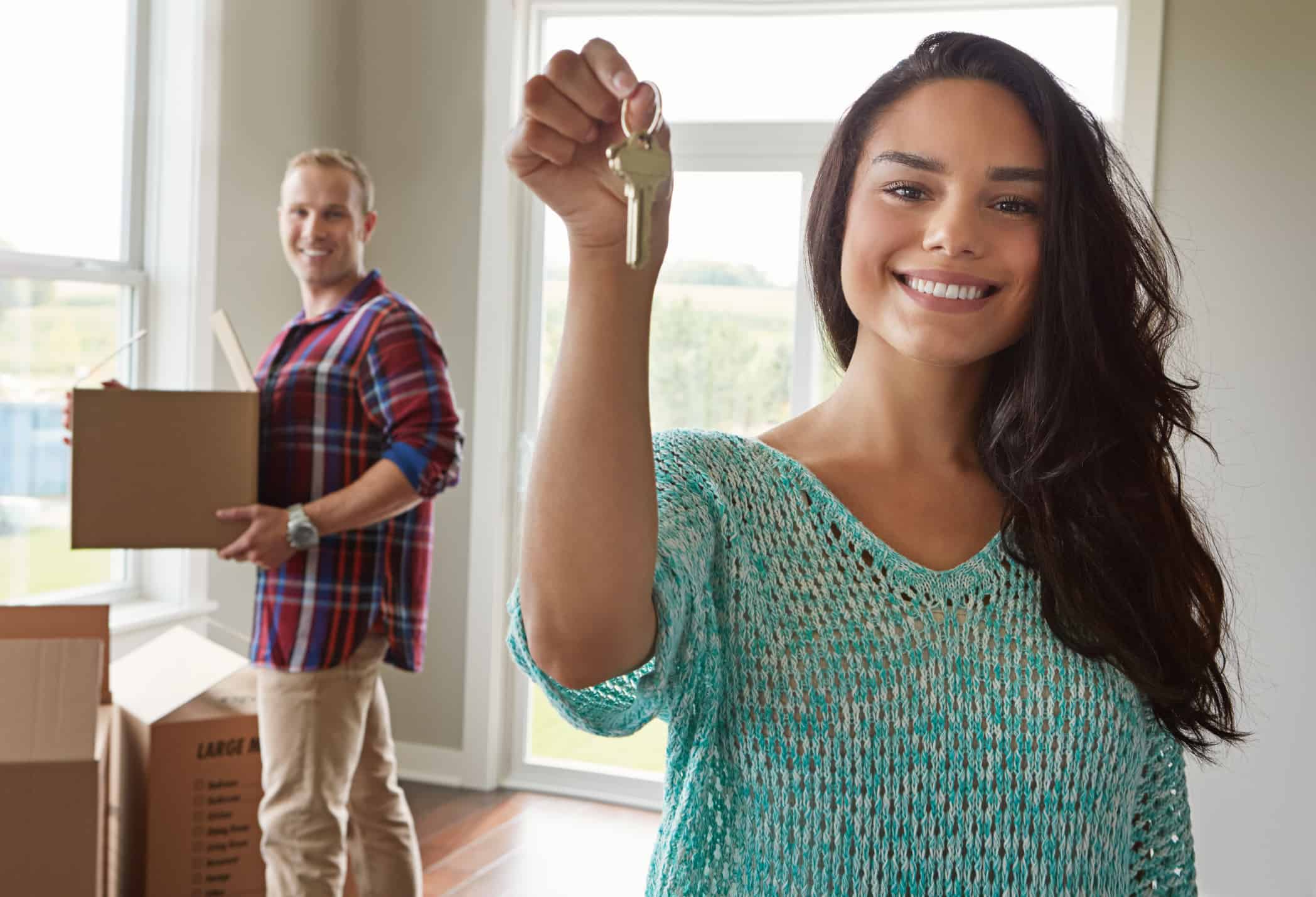 woman moving holding key